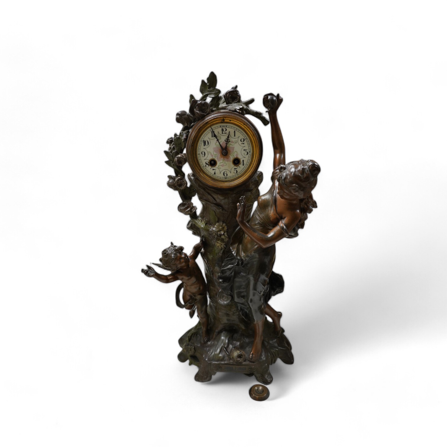 A French Art Nouveau spelter patinated figural table clock, ‘Jardin D’Amour’, with a late 19th century movement striking on a bell, height 53cm. Condition - good